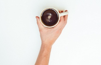 Holding-cup-coffee-1.jpg